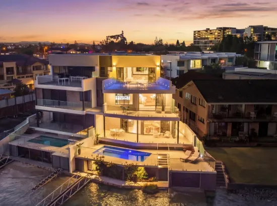 Striking Four-Level Waterfront Entertainer with Rooftop Pavilion and Skyline Views
