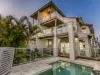 A Rare Exquisite Architecturally Designed Duplex: Steps from Pristine Sands in C