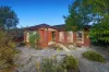 Corner Convenience with Spacious Outdoor Living and Workshop Appeal