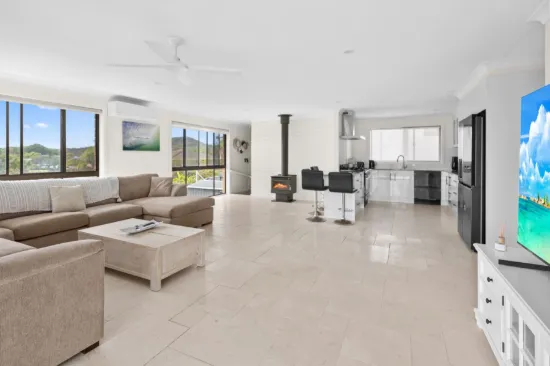 Elevated Coastal Living with Ocean & Mountain Views plus Plenty of Room for Your Toys