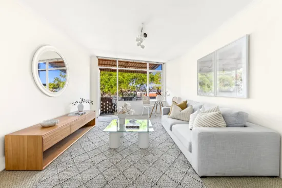 Coastal Top-Floor Retreat with Ocean Views And Lifestyle Convenience