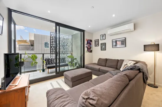 Stylish Prahran Apartment with Rooftop Entertaining & City Views.