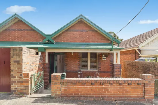 Classic double brick home with level sun filled yard