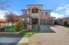Architectural and red-brick elegance with stunning Mulligans Flat Nature Reserve views