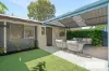 STYLISH, EASY-CARE LIVING IN A PRIVATE COASTAL SETTING