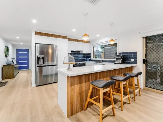 COMPLETE RENOVATION FROM TOP TO BOTTOM - DISPLAY PRESENTATION SET WITHIN AN AMENITY FILLED LOCALE!