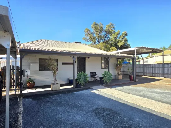 Renovated Home + Two Powered Sheds = The Ultimate Setup