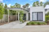STYLISH, LOW-MAINTENANCE LIVING IN A GATED ESTATE WITH POOL