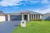 Flawless McDonald Jones family home with oversized shed & premium upgrades
