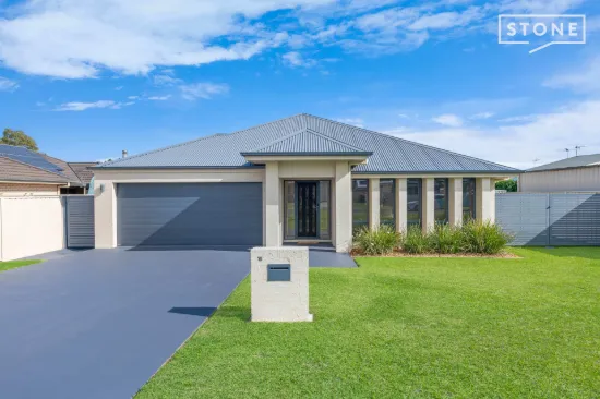 Flawless McDonald Jones family home with oversized shed & premium upgrades

