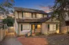 Spacious home offers immense potential in top locale