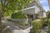 Leafy Courtyard Deck and Street Frontage