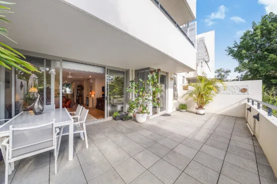 Stylish Ground Floor Apartment with Expansive Courtyard Living Appeal