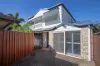 PRIVATE, LOW-MAINTENANCE LIVING IN PRIME PALM BEACH POCKET
