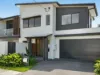 Modern coastal duplex with poolside entertaining and multiple living zones.