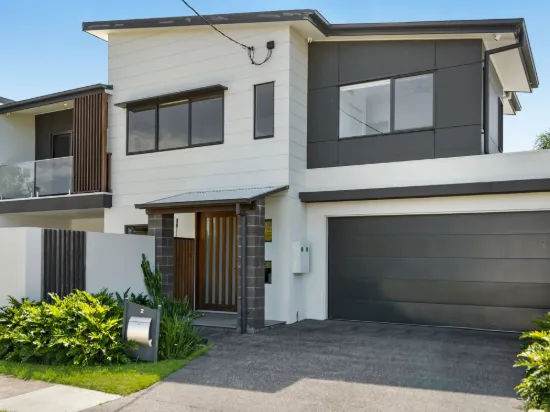 Modern coastal duplex with poolside entertaining and multiple living zones.