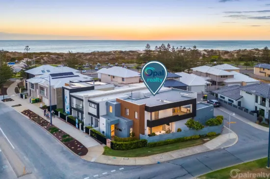 Coastal luxury meets architectural brilliance - one street from the surf