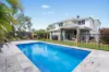 SPARKLING SWIMMING POOL AND CONTEMPORARY EASE IN CORNER BLOCK POSITION