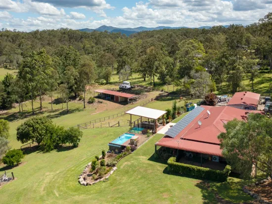 A country low set brick residence on five horse-friendly acres