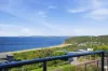 Elevated with sweeping ocean views, resort-style pool and exciting potential