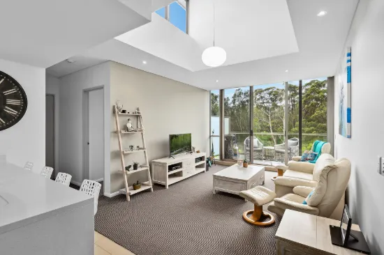 Stylish top floor apartment with serene outlook in sought after complex
