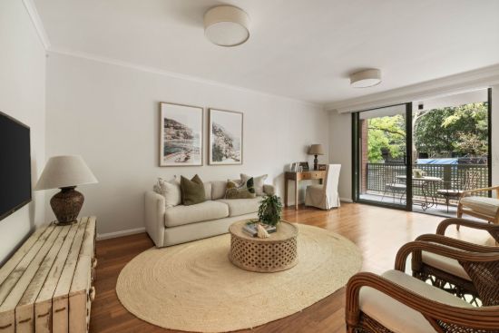 Oversized courtyard apartment in prized `Cambridge Gardens' Space, modern comfort and lifestyle in resort-style complex
