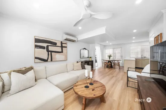 The Complete Package – Fully Renovated Townhome with Rare Wrap Around Courtyard & Solar