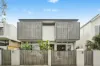 Stylish Designer Townhouse with Parking in a Prestigious Beachside Address
