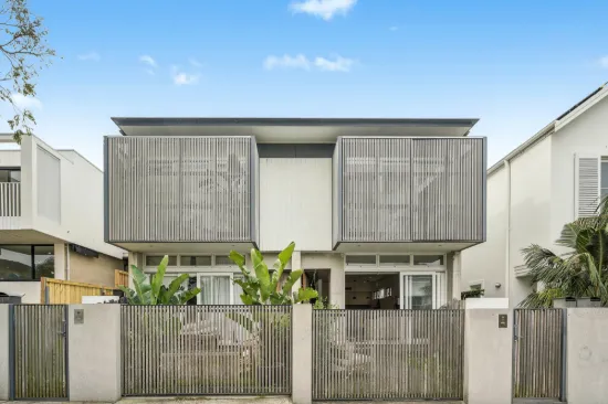 Stylish Designer Townhouse with Parking in a Prestigious Beachside Address