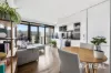 Sunlit balcony living with a walk-to-everything lifestyle