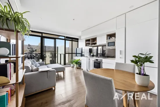 Sunlit balcony living with a walk-to-everything lifestyle
