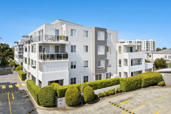 Updated garden apartment in prime coastal locale