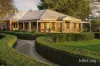 Recycled red brick homestead in idyllic garden surrounds