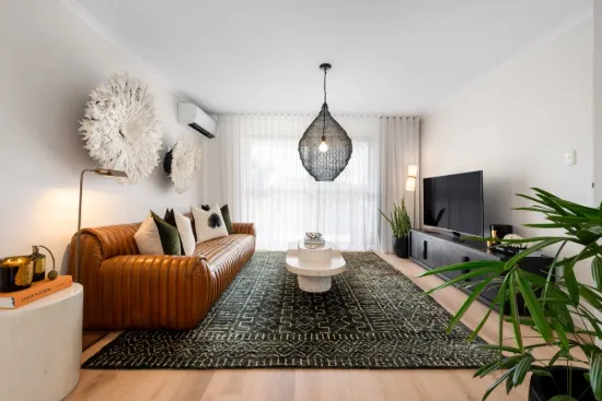 Top-Floor Corner Retreat with Dual Lock-Up Garages