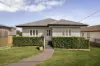 Remarkable Renovation with Breezy Entertaining and Leafy Privacy