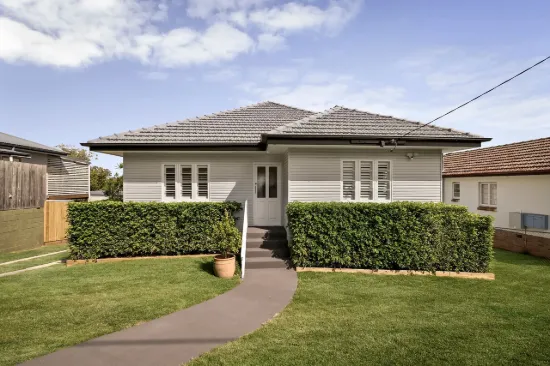 Remarkable Renovation with Breezy Entertaining and Leafy Privacy