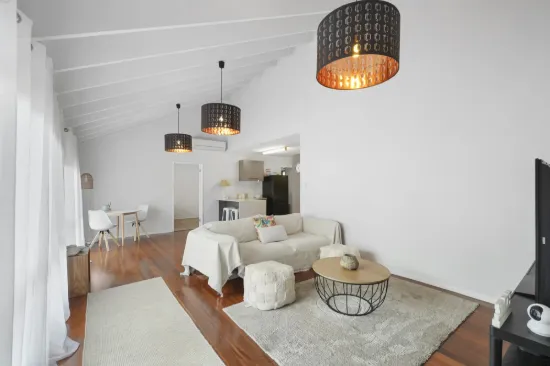 VERSATILE FAMILY LIVING WITH ENTERTAINER'S DECK IN PRIME SOUTHPORT POSITION