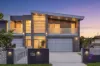 Full brick architectural home reveals a statement in modern family entertaining with in ground pool 