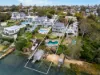 Two homes sold together or separately in prestigious waterfront pocket