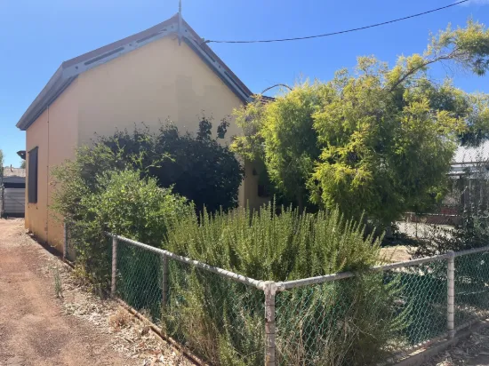 Charming Character Cottage with Endless Potential!