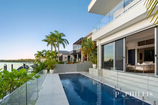 Architectural Waterfront mansion. 6-Car Garage & 4m Ceilings. The WOW factor