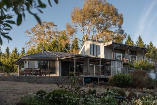 Expansive five-bedroom home, private gated setting, multiple living areas, outdoor entertaining with pool and spa, large garage and shed