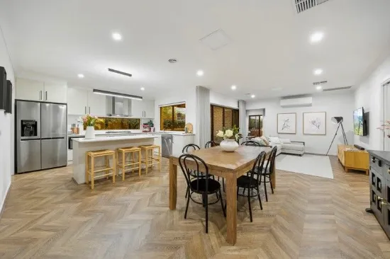 MODERN SOPHISTICATION IN A COVETED SETTING - 3 LIVING ZONES + DUAL OUTDOOR AREAS!