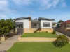 Fully renovated Mid-century with elevated views and flexible living options for a large family.