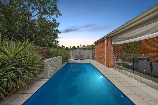 EASY CARE ENTERTAINER WITH IN-GROUND POOL - POPULAR AMENITY FILLED LOCALE!