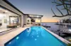 SCARCE SINGLE LEVEL WATERFRONT ELEGANCE ON SOVEREIGN ISLANDS WITH PROTECTED MOORING 
