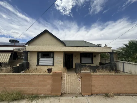 Renovator with potential in great location!