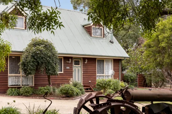 Cottage charm on a quarter acre with exceptional shedding