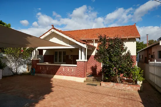 Timeless character home with a white picket fence.
