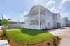 Brand new freestanding 4-bedroom home in pretty, riverside setting